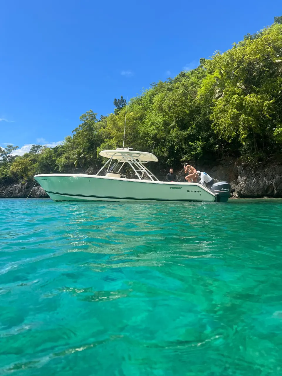 Guests on the deck of an excursion boat heading out from Las Terrenas